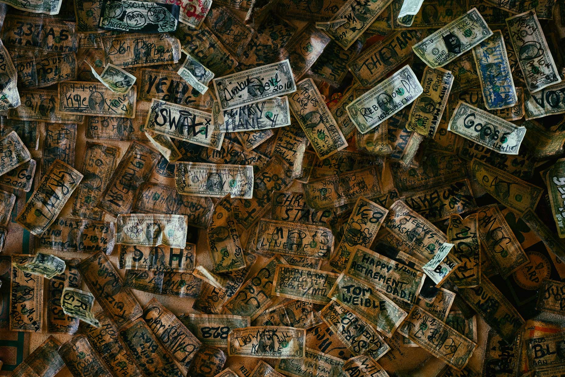 Wall of money in New Orleans by photographer Kevin Brown