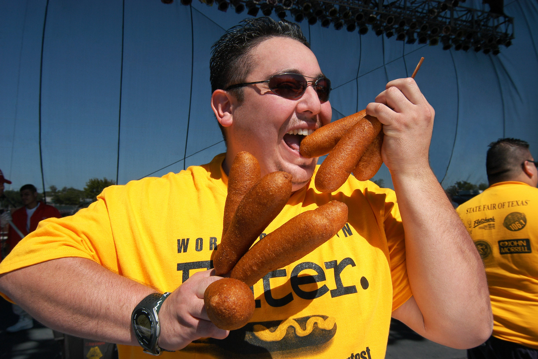 Corny Dog contest eater at The State Fair of Texas. Photography by Kevin Brown