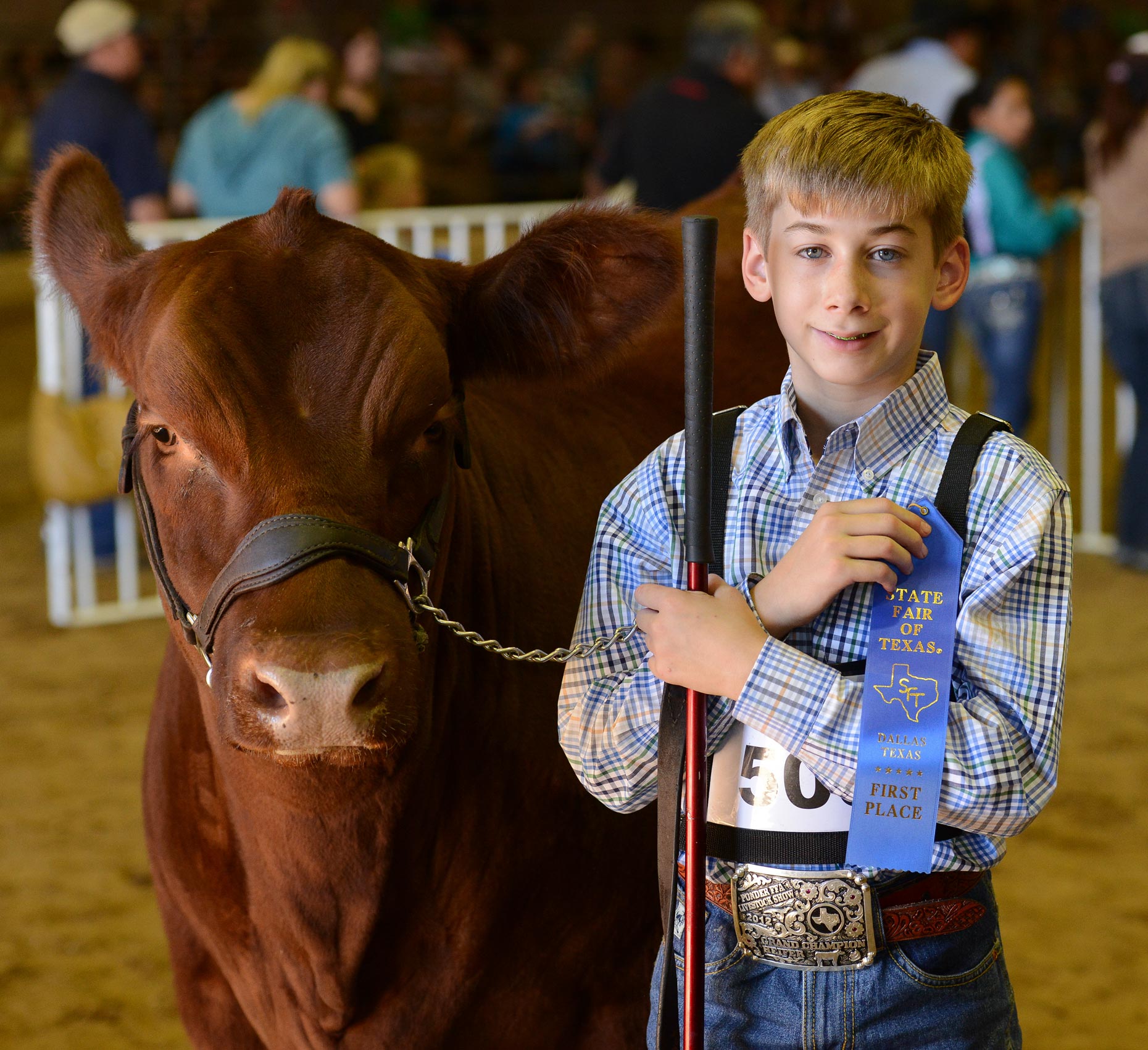 Youth with livestock at The State Fair of Texas. Photography by Kevin Brown